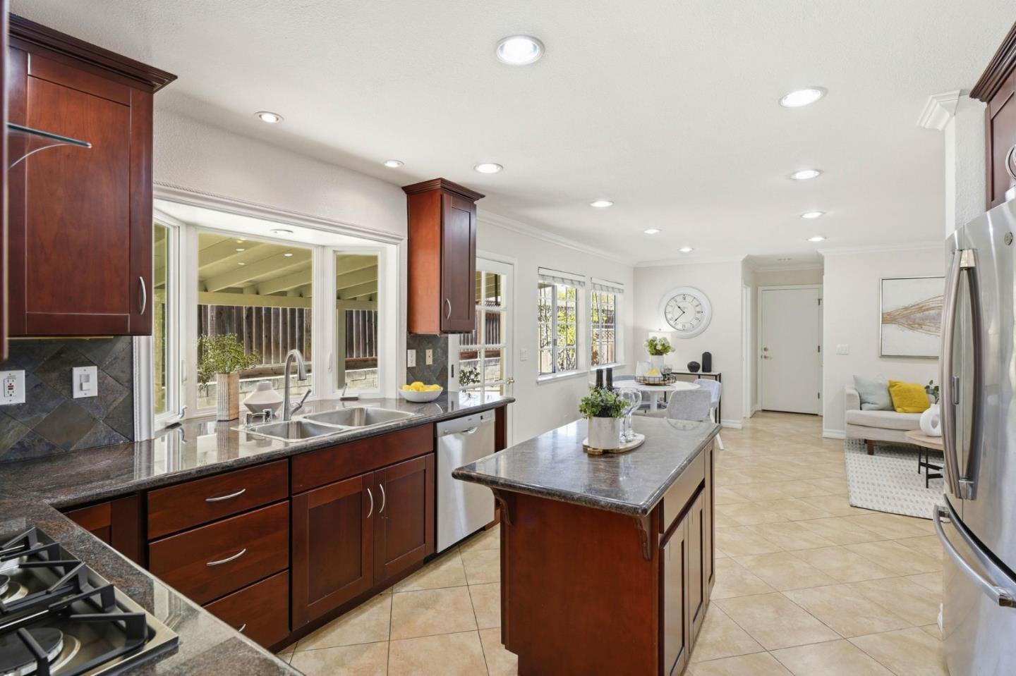 6207 McAbee Road San Jose, CA 95120 - Photo 15 of 48 a large kitchen with a large counter top space appliances and a sink