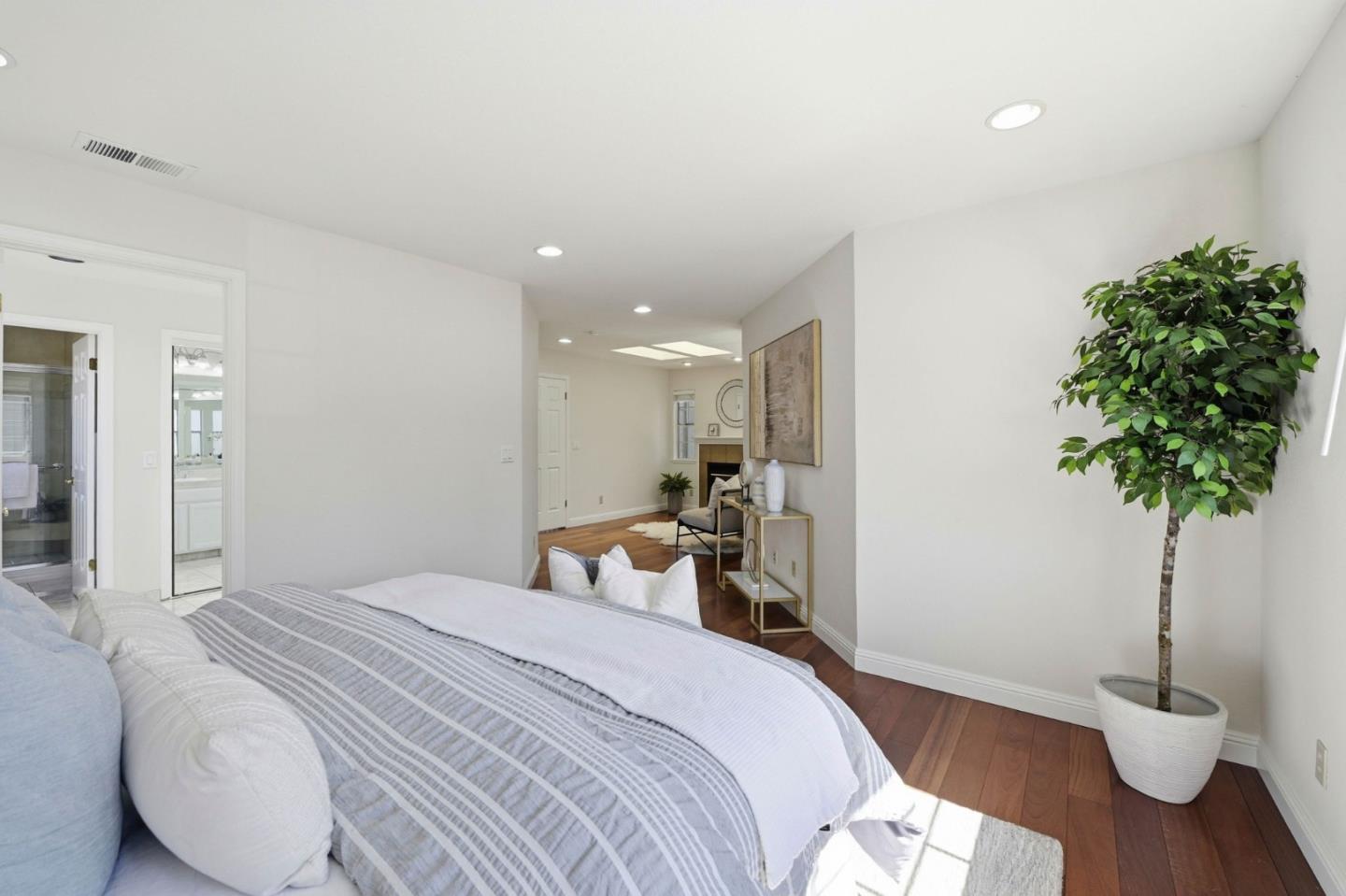 6207 McAbee Road San Jose, CA 95120 - Photo 24 of 48 a bedroom with a bed and a potted plant