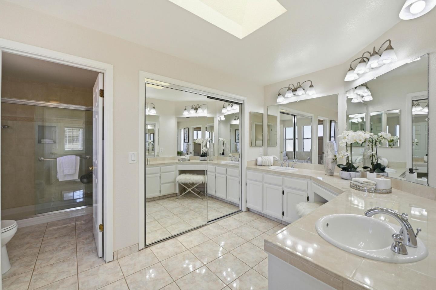 6207 McAbee Road San Jose, CA 95120 - Photo 26 of 48 a bathroom with a tub sink and mirror