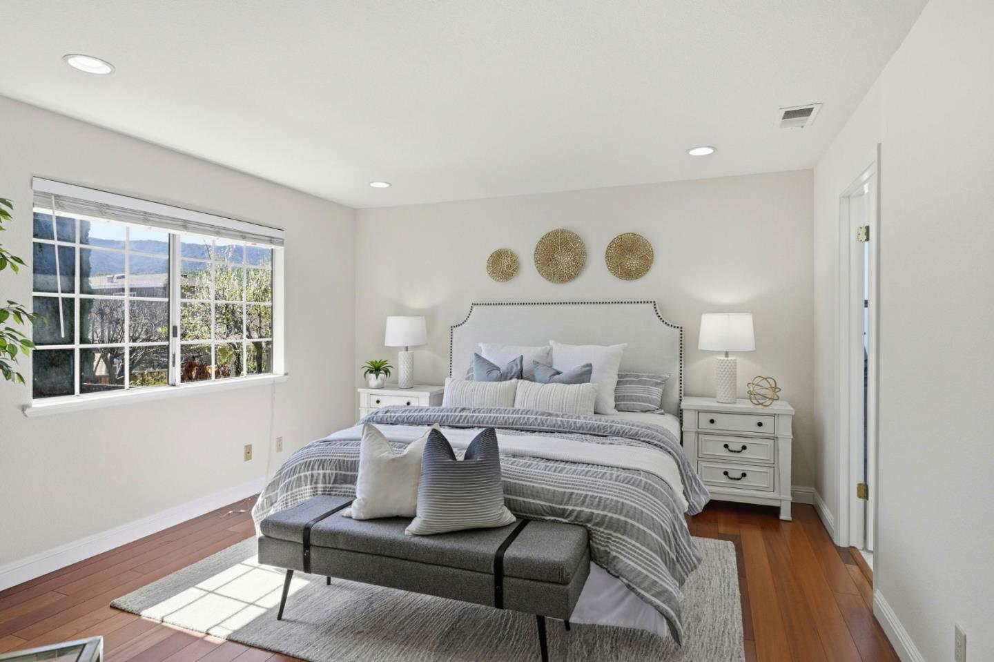 6207 McAbee Road San Jose, CA 95120 - Photo 29 of 48 a bedroom with a bed and wooden floor