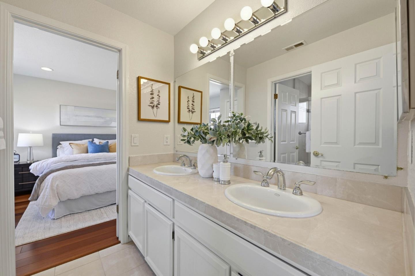 6207 McAbee Road San Jose, CA 95120 - Photo 31 of 48 a en suite bathroom with double vanity and a mirror