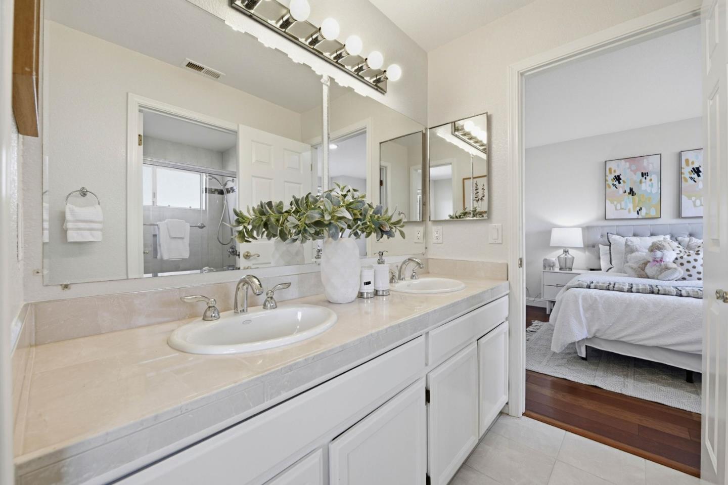 6207 McAbee Road San Jose, CA 95120 - Photo 34 of 48 a en suite bathroom with a double vanity sink and mirror