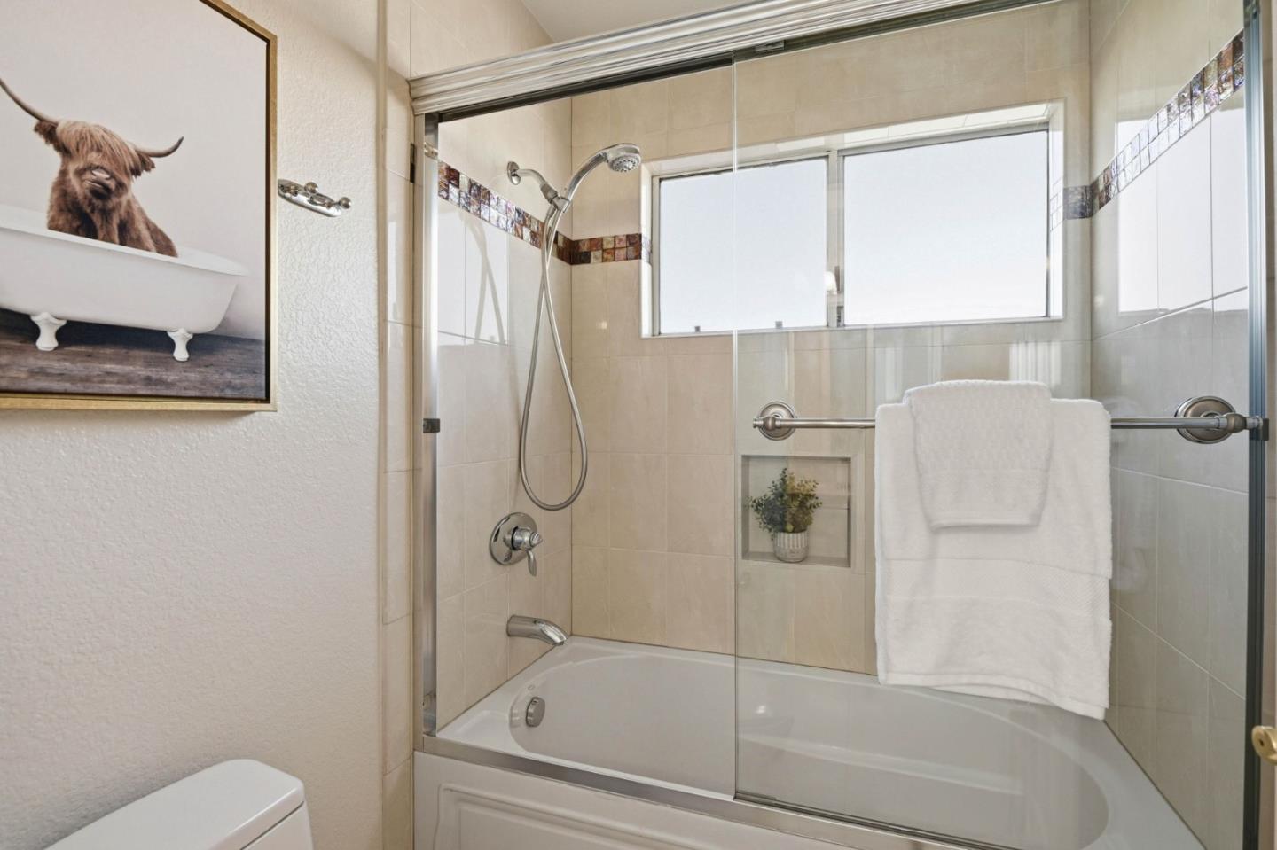 6207 McAbee Road San Jose, CA 95120 - Photo 36 of 48 a bathroom with a shower and a toilet