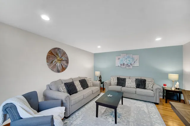 a living room with furniture and a table