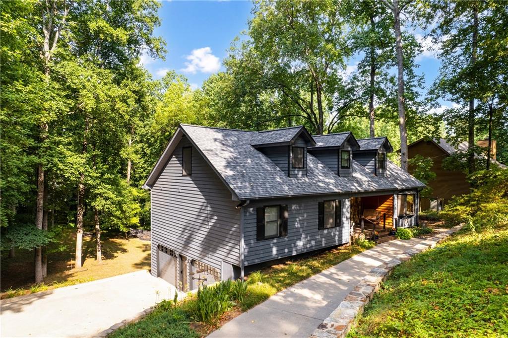 119 Hunters Mill Road Woodstock, GA 30188 - Photo 1 of 1 a view of house with outdoor space and sitting area