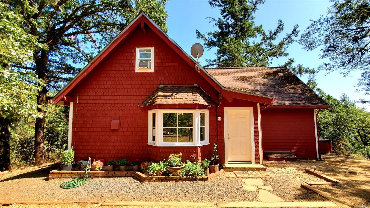 24300 String Creek Road Willits, CA 95490 - Photo 1 of 1 a front view of a house with a yard
