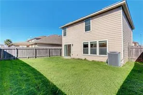 a view of an house with backyard space and garden