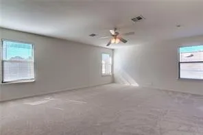 a view of empty room with windows