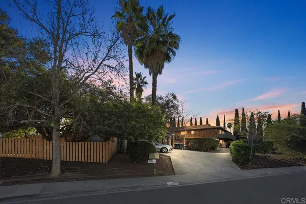 a kitchen with stainless steel appliances kitchen island granite countertop a refrigerator and a stove top oven