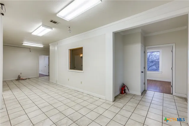 a view of an empty room and window