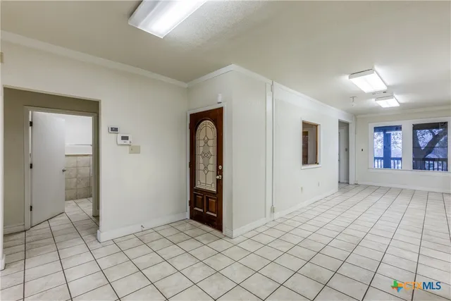 a view of an empty room and window