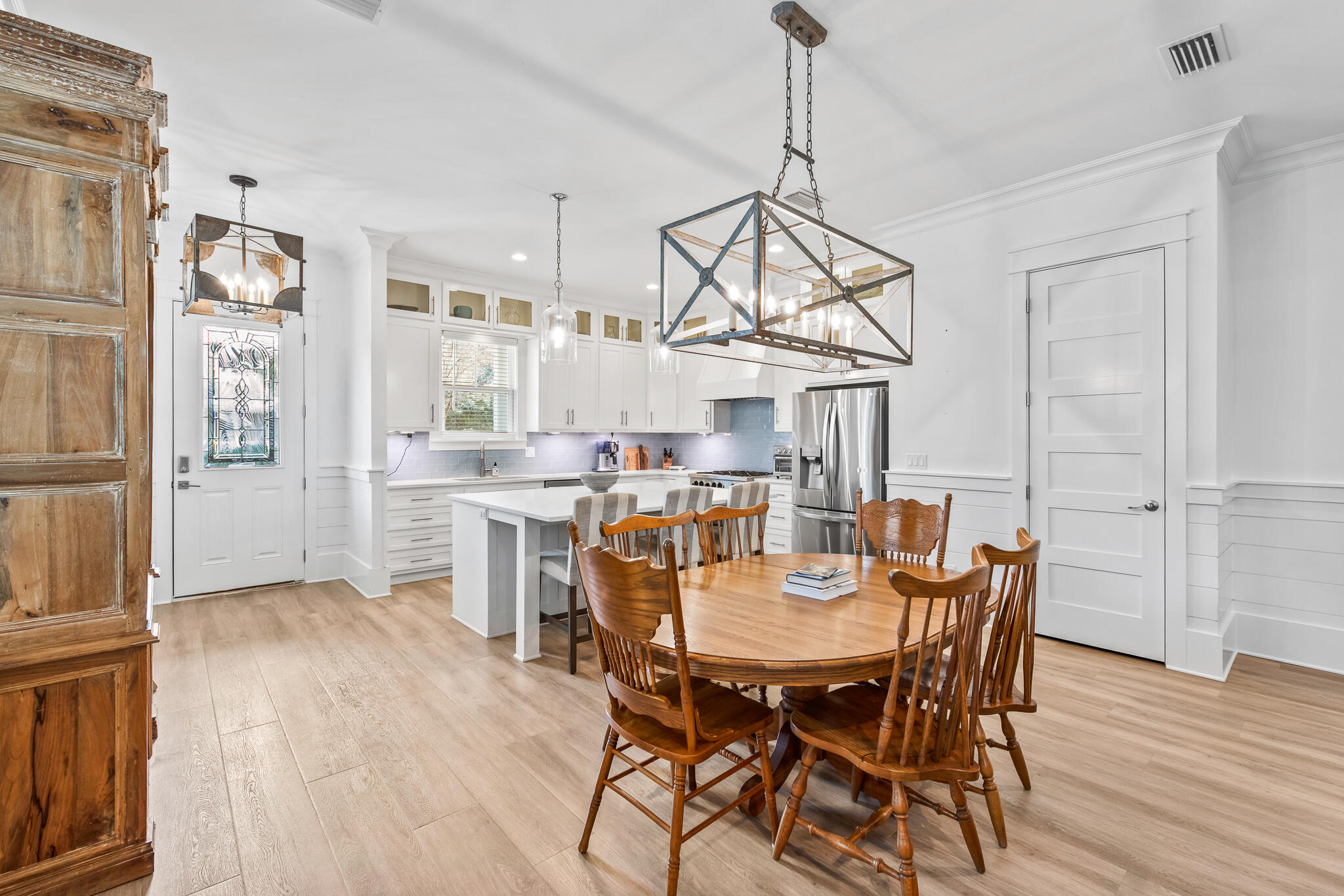 175 Greenbriar Lane Santa Rosa Beach, FL 32459 - Photo 11 of 77 a view of a dining room with furniture and wooden floor