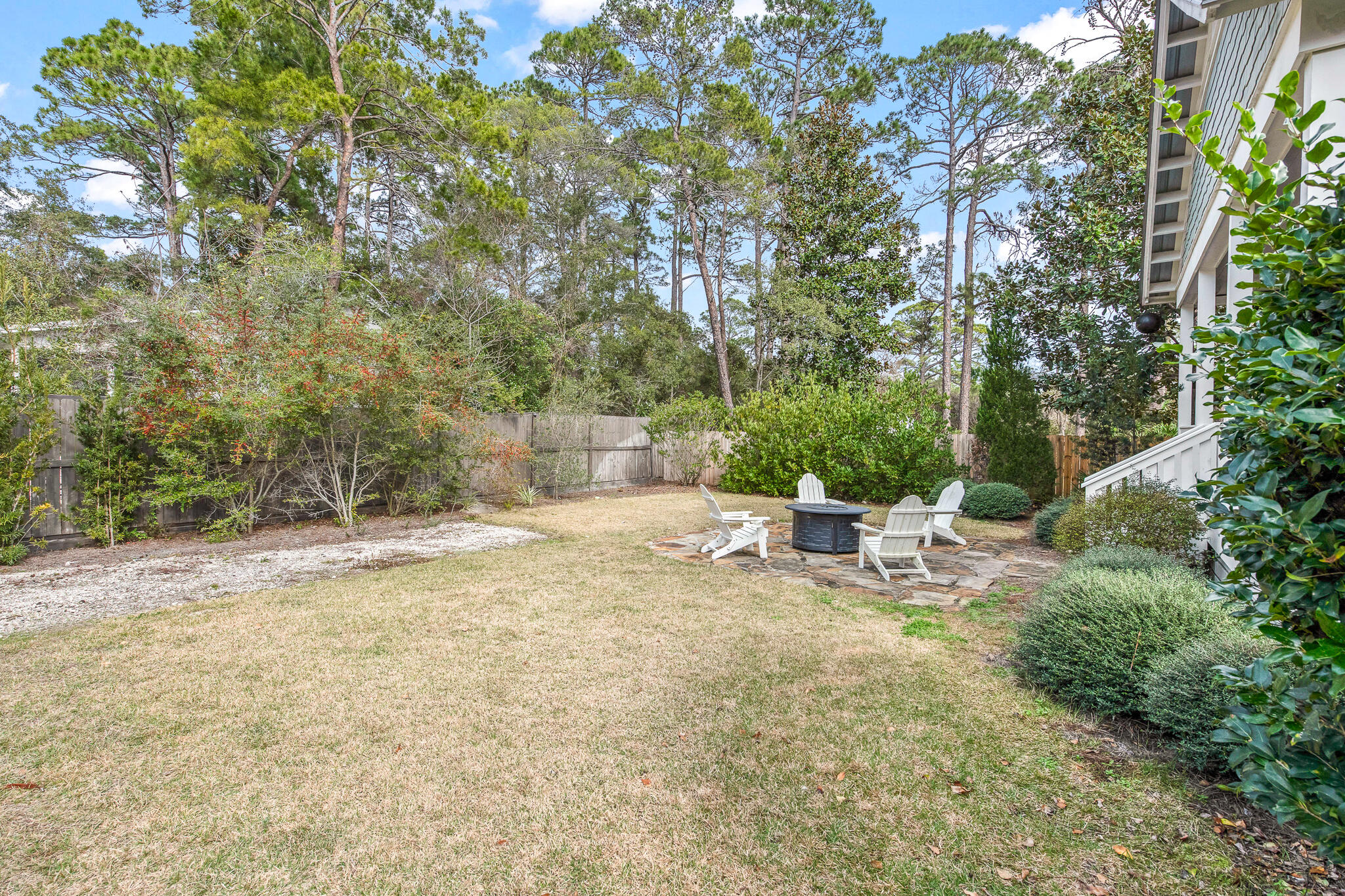 175 Greenbriar Lane Santa Rosa Beach, FL 32459 - Photo 48 of 77 a view of a backyard with a bench and some trees