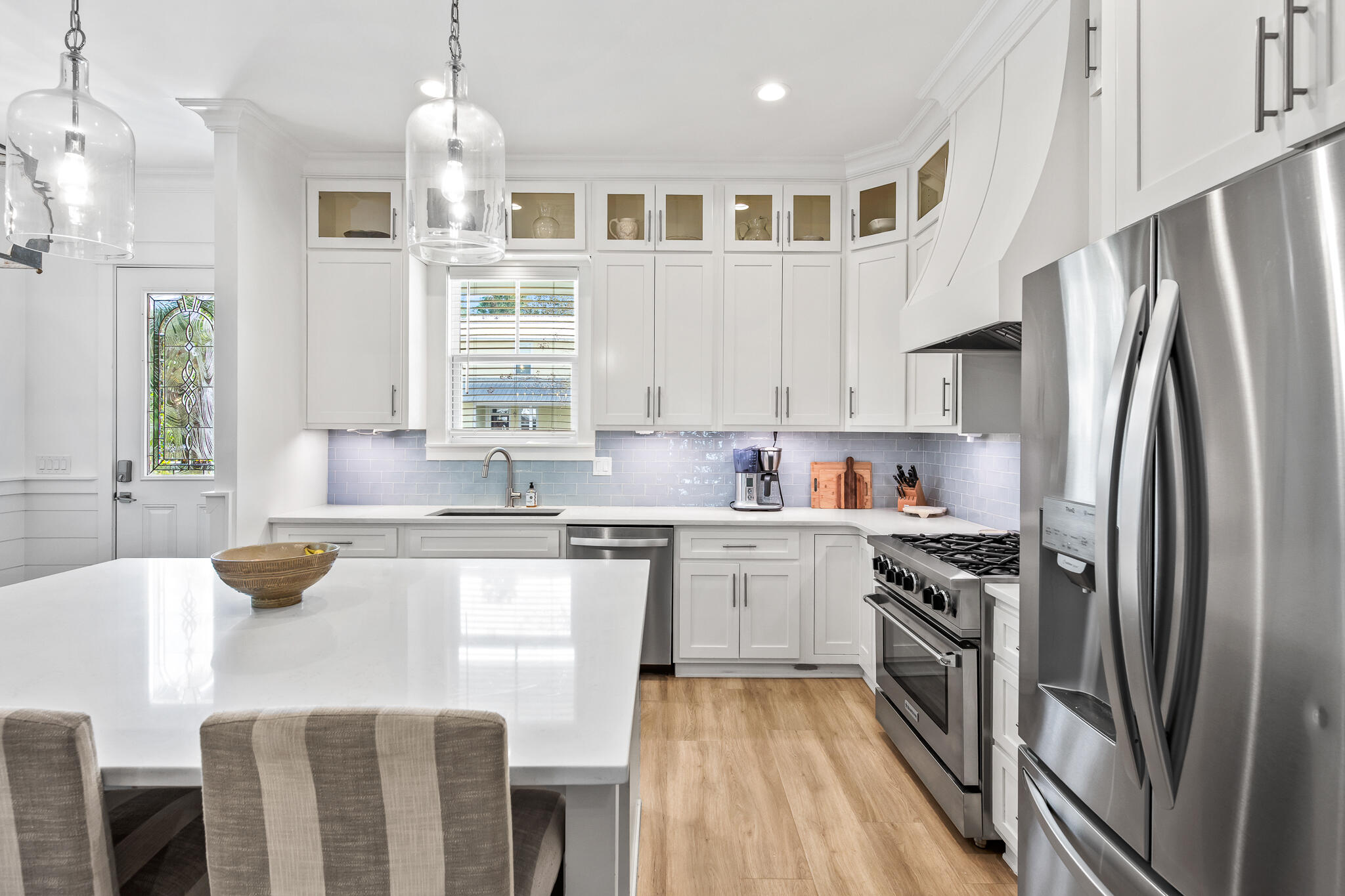 175 Greenbriar Lane Santa Rosa Beach, FL 32459 - Photo 5 of 77 a kitchen with stainless steel appliances granite countertop a refrigerator a sink dishwasher a stove and white cabinets with wooden floor