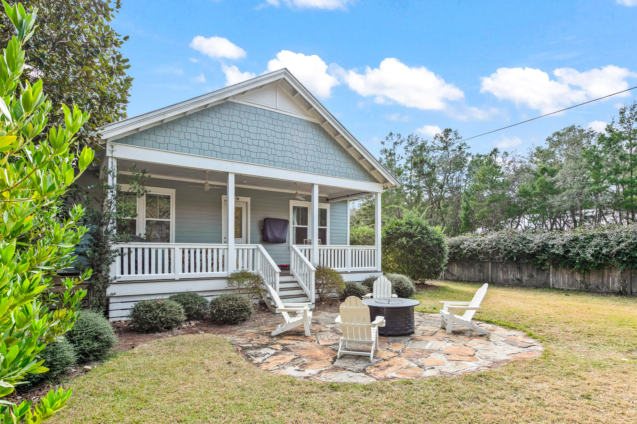175 Greenbriar Lane Santa Rosa Beach, FL 32459 - Photo 53 of 77 a front view of a house with garden and chairs