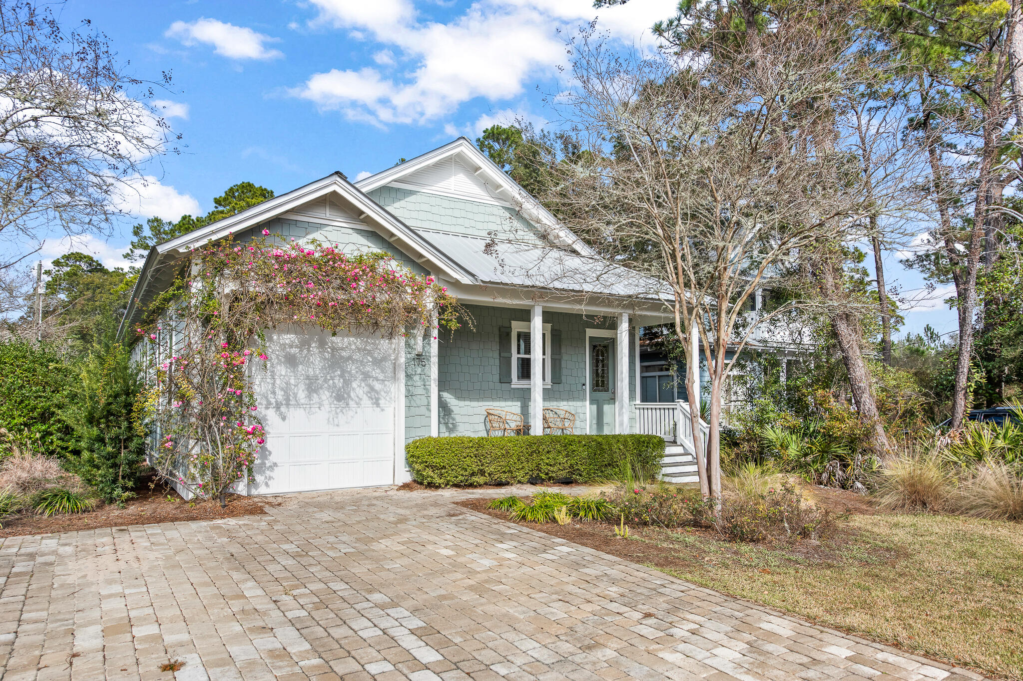 175 Greenbriar Lane Santa Rosa Beach, FL 32459 - Photo 62 of 77 a front view of a house with a yard and potted plants