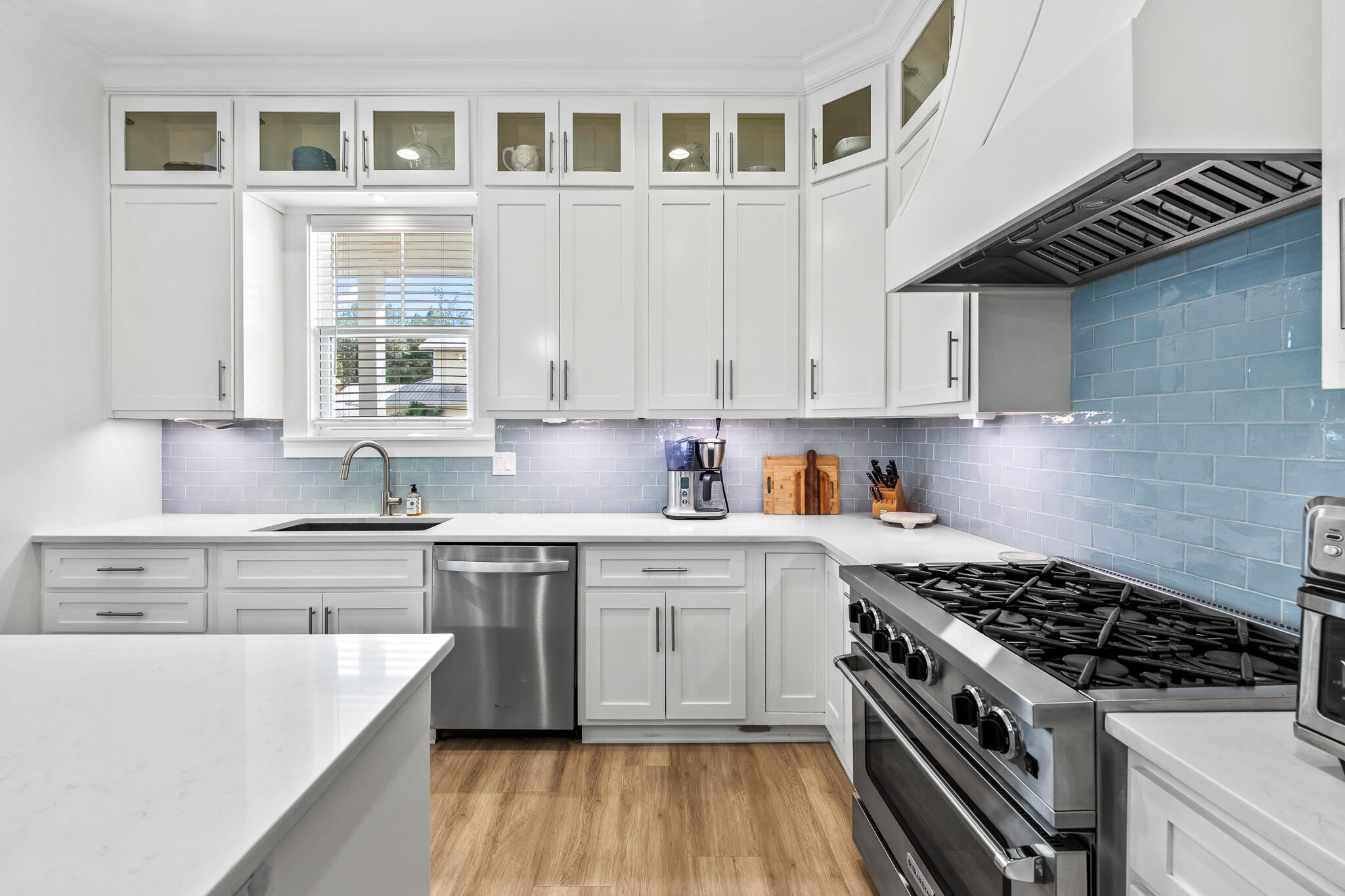 175 Greenbriar Lane Santa Rosa Beach, FL 32459 - Photo 7 of 77 a kitchen with stainless steel appliances a stove a sink and cabinets