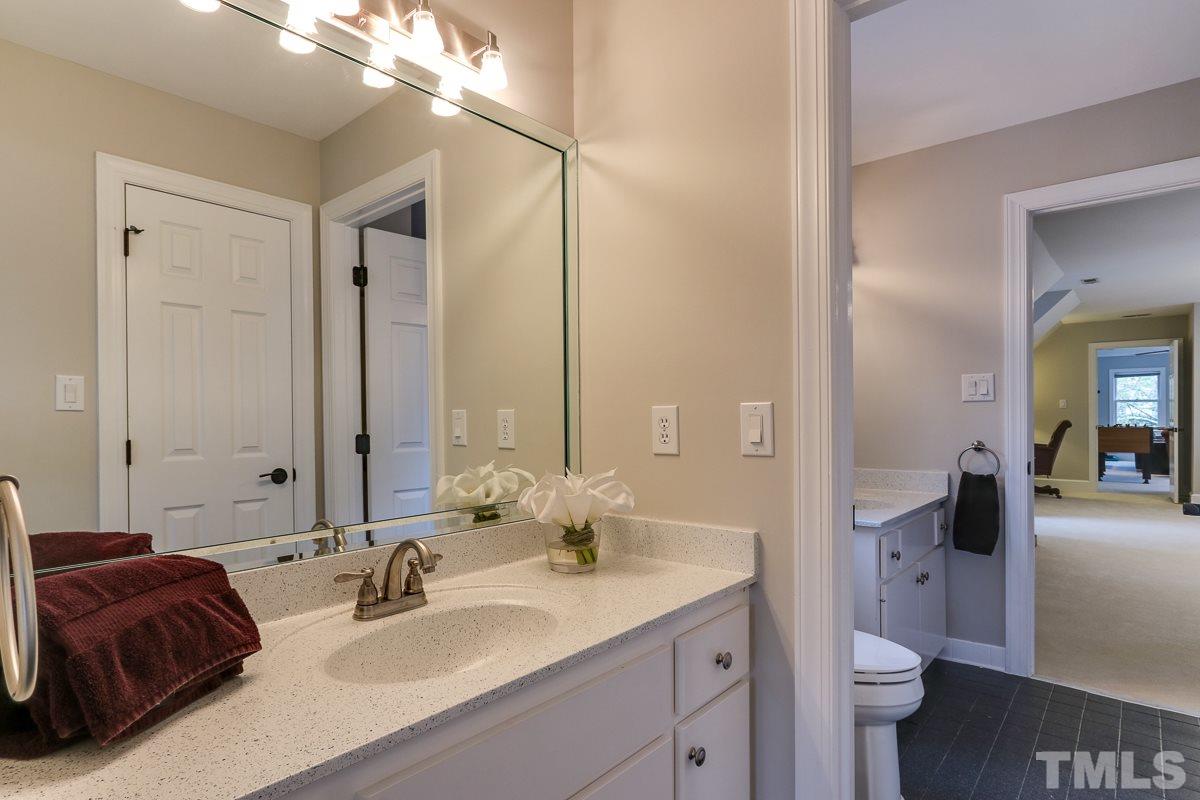 2001 Malvern Court Raleigh, NC 27615 - Photo 22 of 25 a en suite bathroom with a double vanity sink and a mirror
