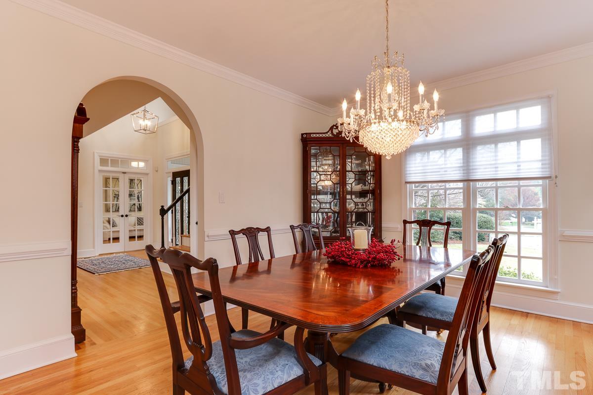2001 Malvern Court Raleigh, NC 27615 - Photo 4 of 25 a view of a dining room with furniture window and wooden floor