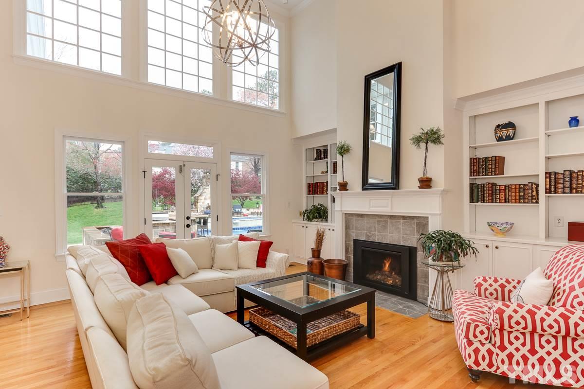 2001 Malvern Court Raleigh, NC 27615 - Photo 5 of 25 a living room with furniture fireplace and a large window