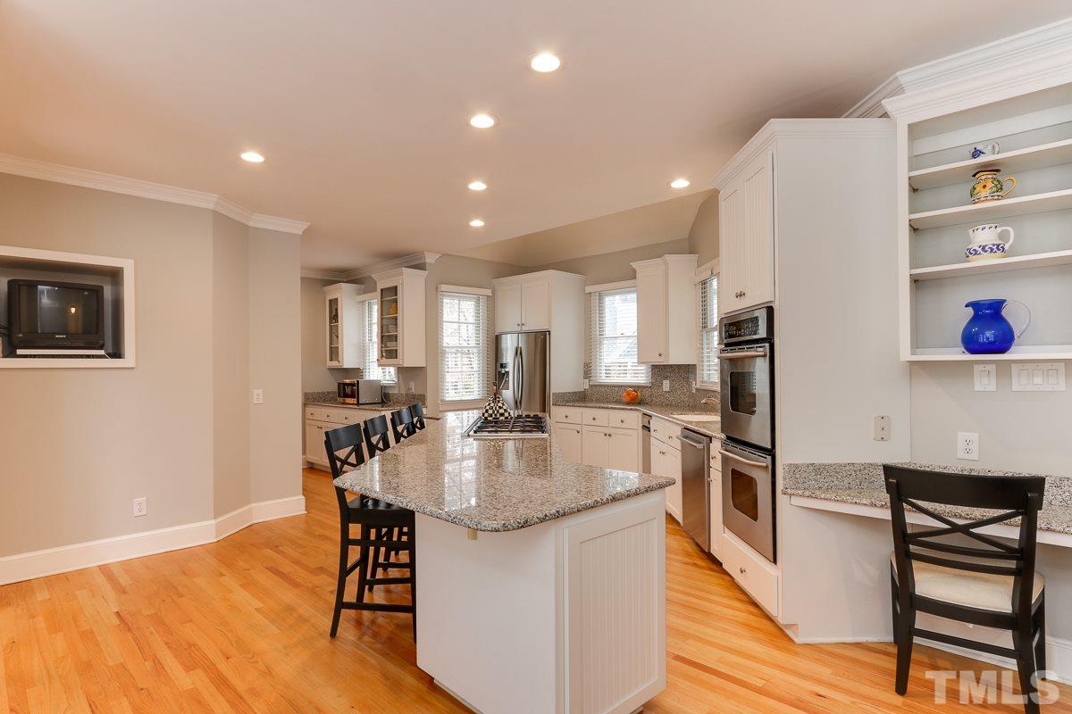 2001 Malvern Court Raleigh, NC 27615 - Photo 10 of 25 a kitchen with stainless steel appliances granite countertop counter space a sink and a refrigerator