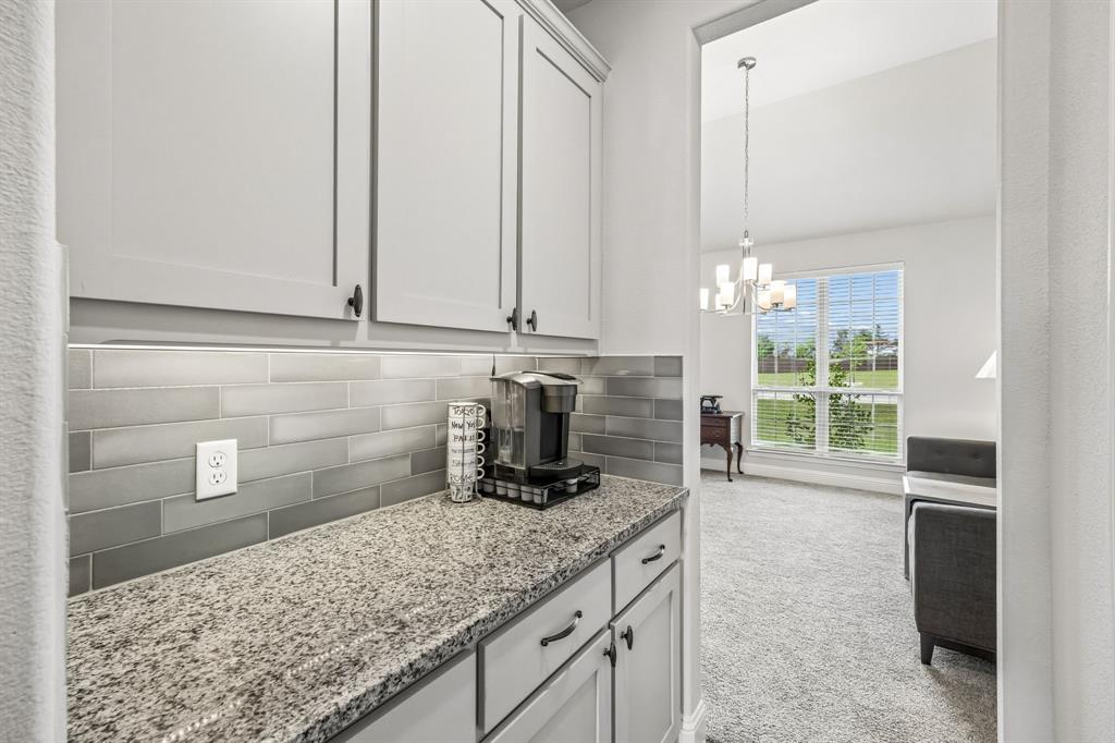 1581 Lynx Loop Forney, TX 75126 - Photo 15 of 38 Butler's pantry between the kitchen and formal dining room.