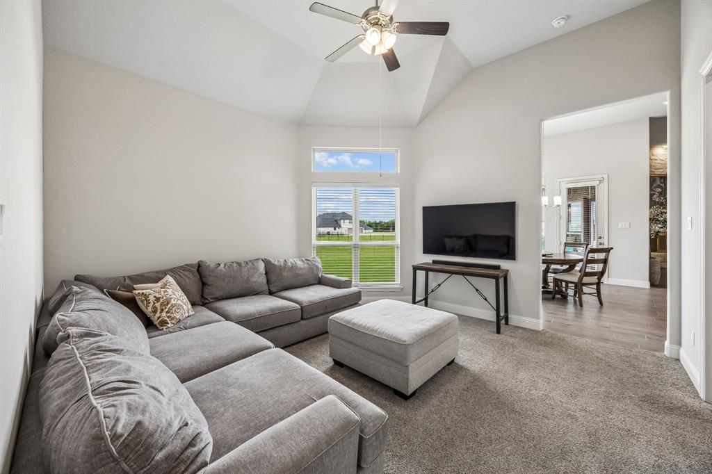 1581 Lynx Loop Forney, TX 75126 - Photo 17 of 38 2nd Living room with a ceiling fan, carpet floors, and vaulted ceiling