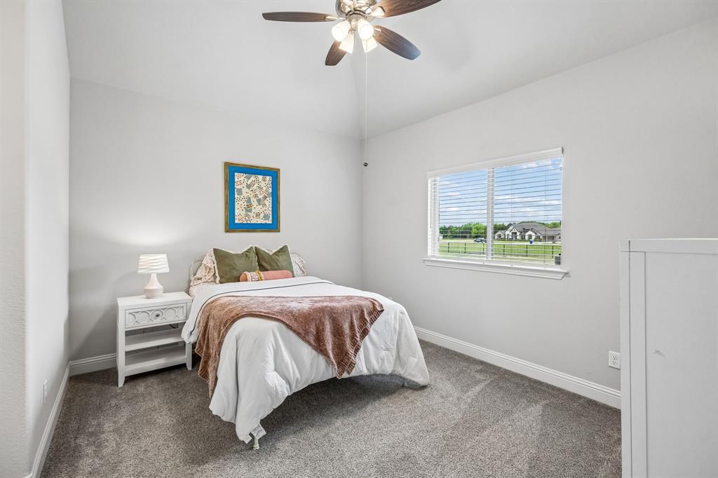 1581 Lynx Loop Forney, TX 75126 - Photo 27 of 38 Carpeted bedroom featuring ceiling fan and lofted ceiling