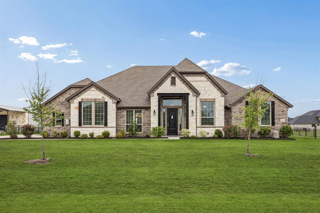 1581 Lynx Loop Forney, TX 75126 - Photo 3 of 38 French country style house featuring stone siding, brick siding, and a shingled roof