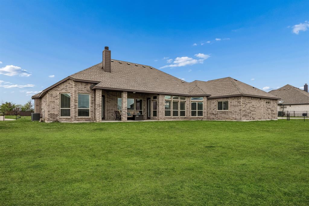 1581 Lynx Loop Forney, TX 75126 - Photo 33 of 38 Rear view of house featuring a patio area,