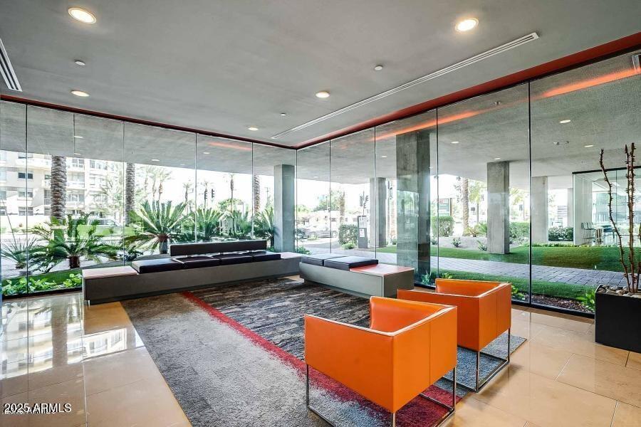 4808 North 24th Street, Unit 1005 Phoenix, AZ 85016 - Photo 26 of 34 a living room with furniture and a large window