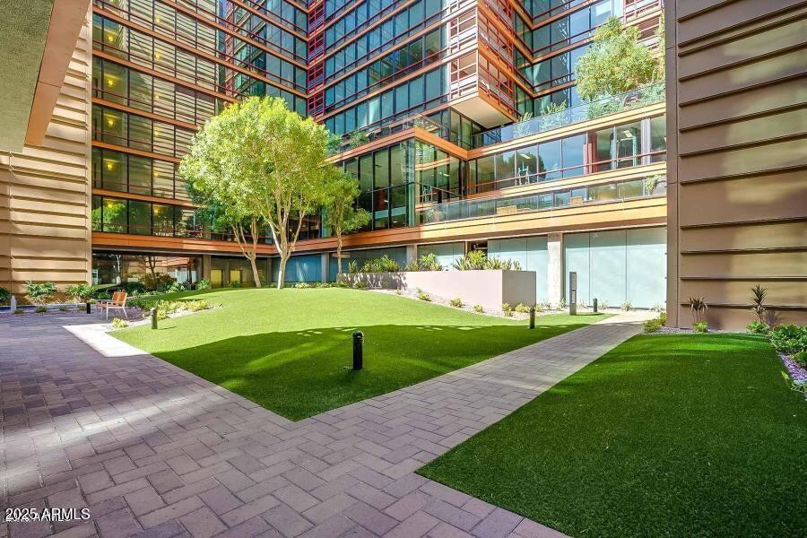 4808 North 24th Street, Unit 1005 Phoenix, AZ 85016 - Photo 28 of 34 a view of a building with a yard