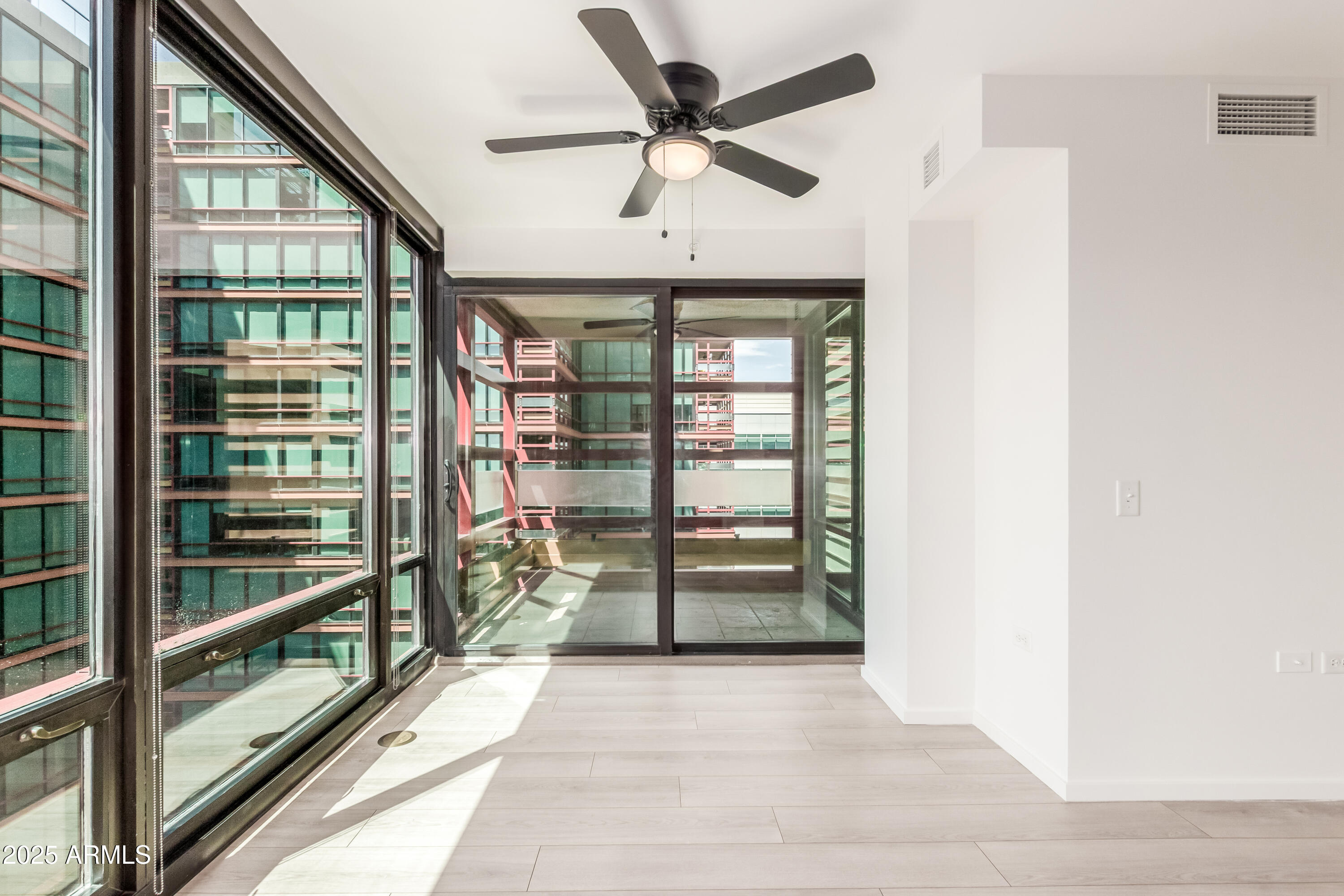 4808 North 24th Street, Unit 1005 Phoenix, AZ 85016 - Photo 3 of 34 a view of a hallway with a window