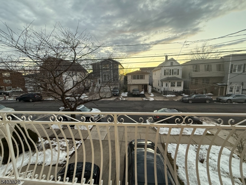 527 4th Avenue, Unit 1 Elizabeth, NJ 07202 - Photo 20 of 21 a view of a patio with table and chairs with wooden fence