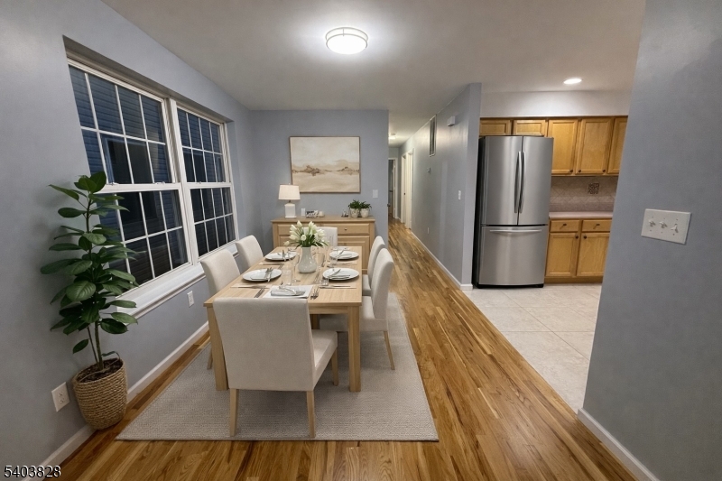 527 4th Avenue, Unit 1 Elizabeth, NJ 07202 - Photo 5 of 21 a dining room with furniture and a potted plant