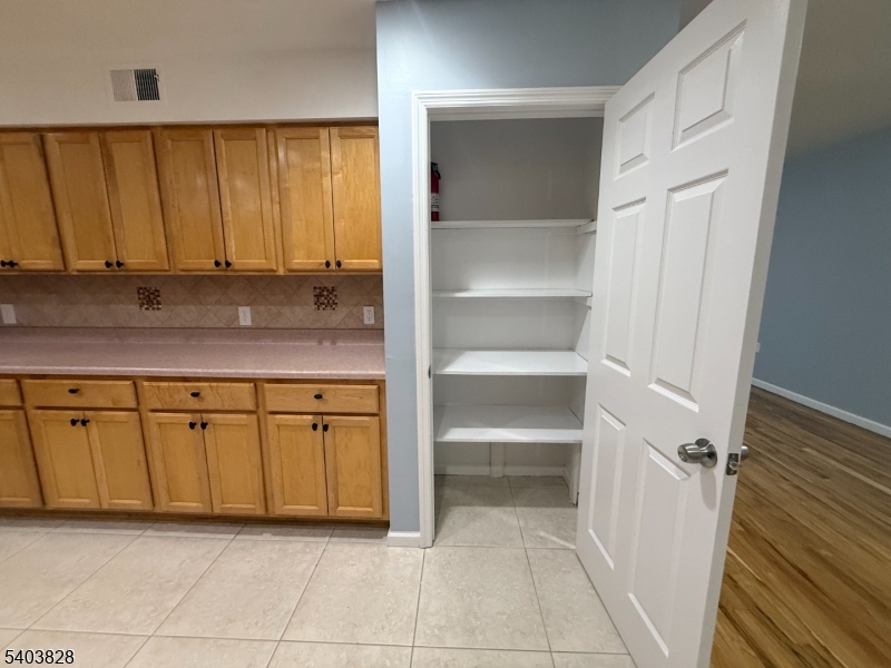 527 4th Avenue, Unit 1 Elizabeth, NJ 07202 - Photo 9 of 21 a bathroom with a granite countertop sink and a mirror