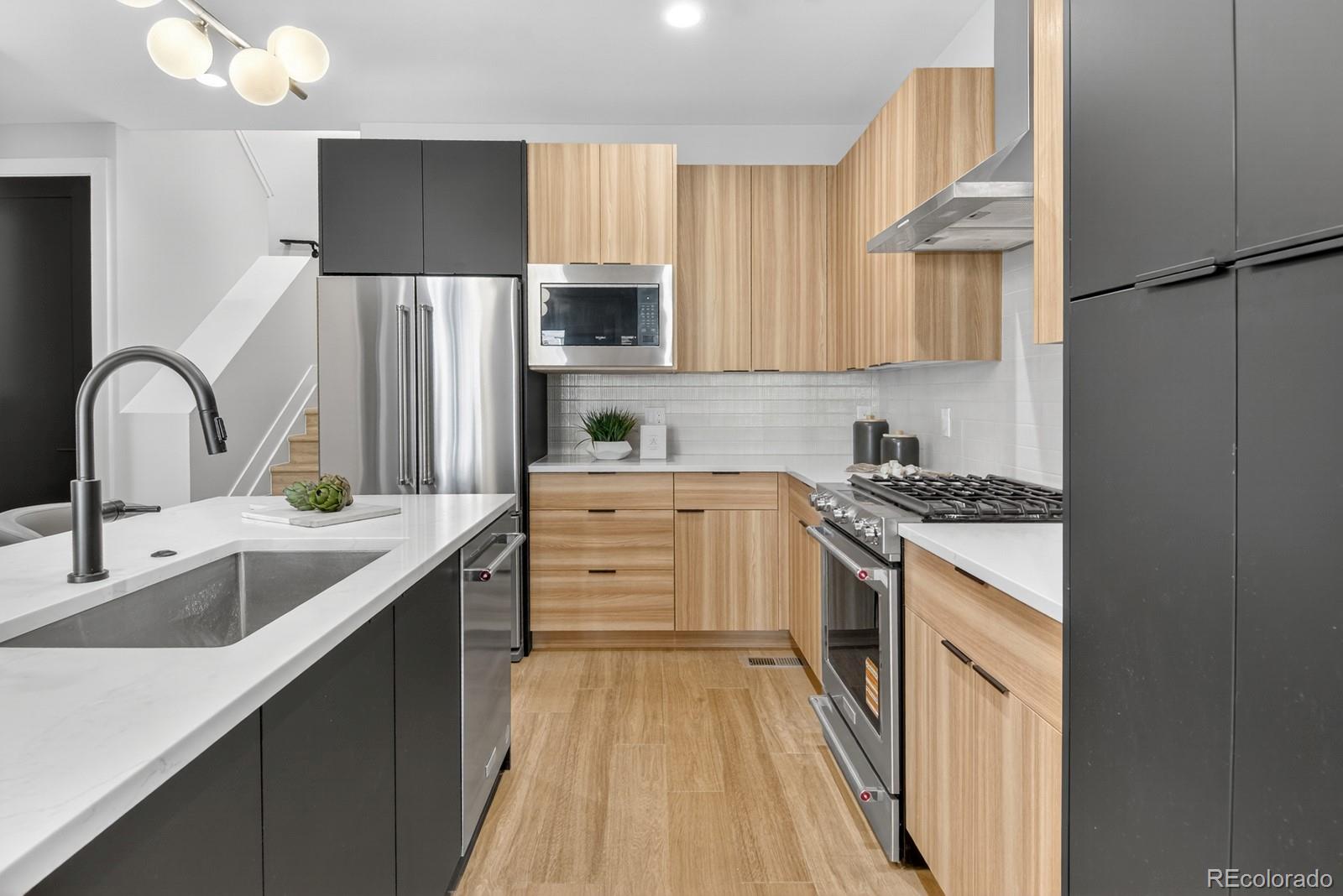 832 North Cherry Street, Unit 1 Denver, CO 80220 - Photo 12 of 41 a kitchen with stainless steel appliances granite countertop a sink stove and refrigerator