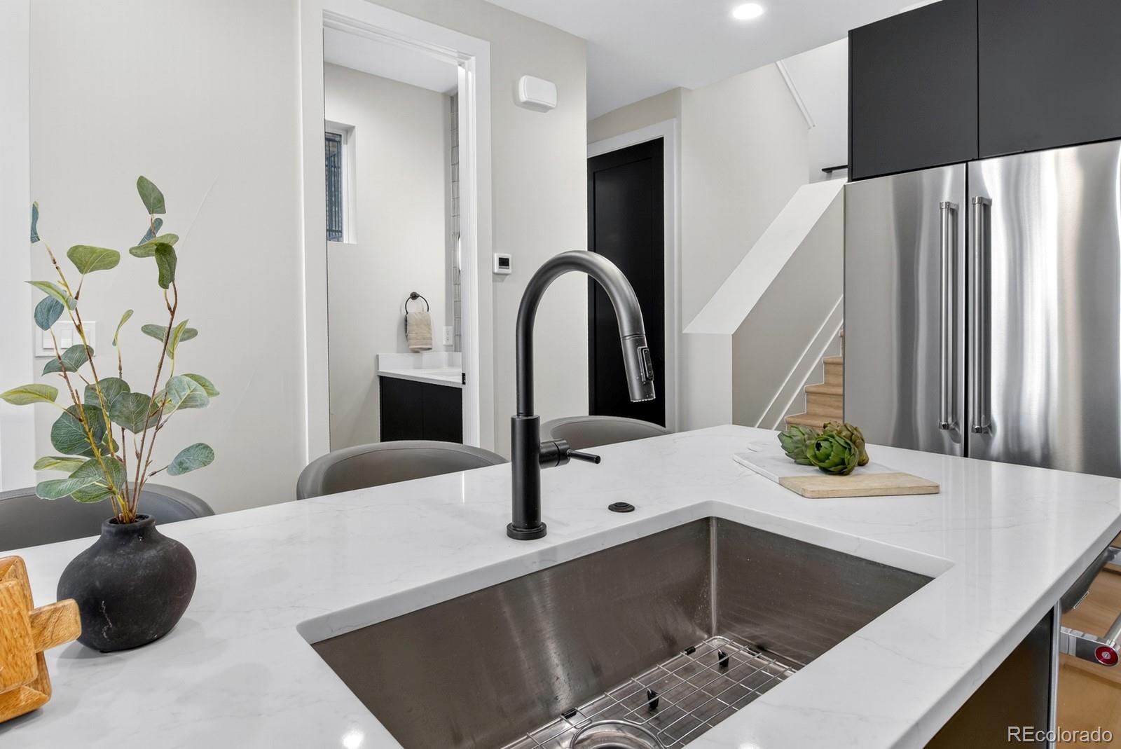 832 North Cherry Street, Unit 1 Denver, CO 80220 - Photo 13 of 41 a kitchen with a sink and a potted plant