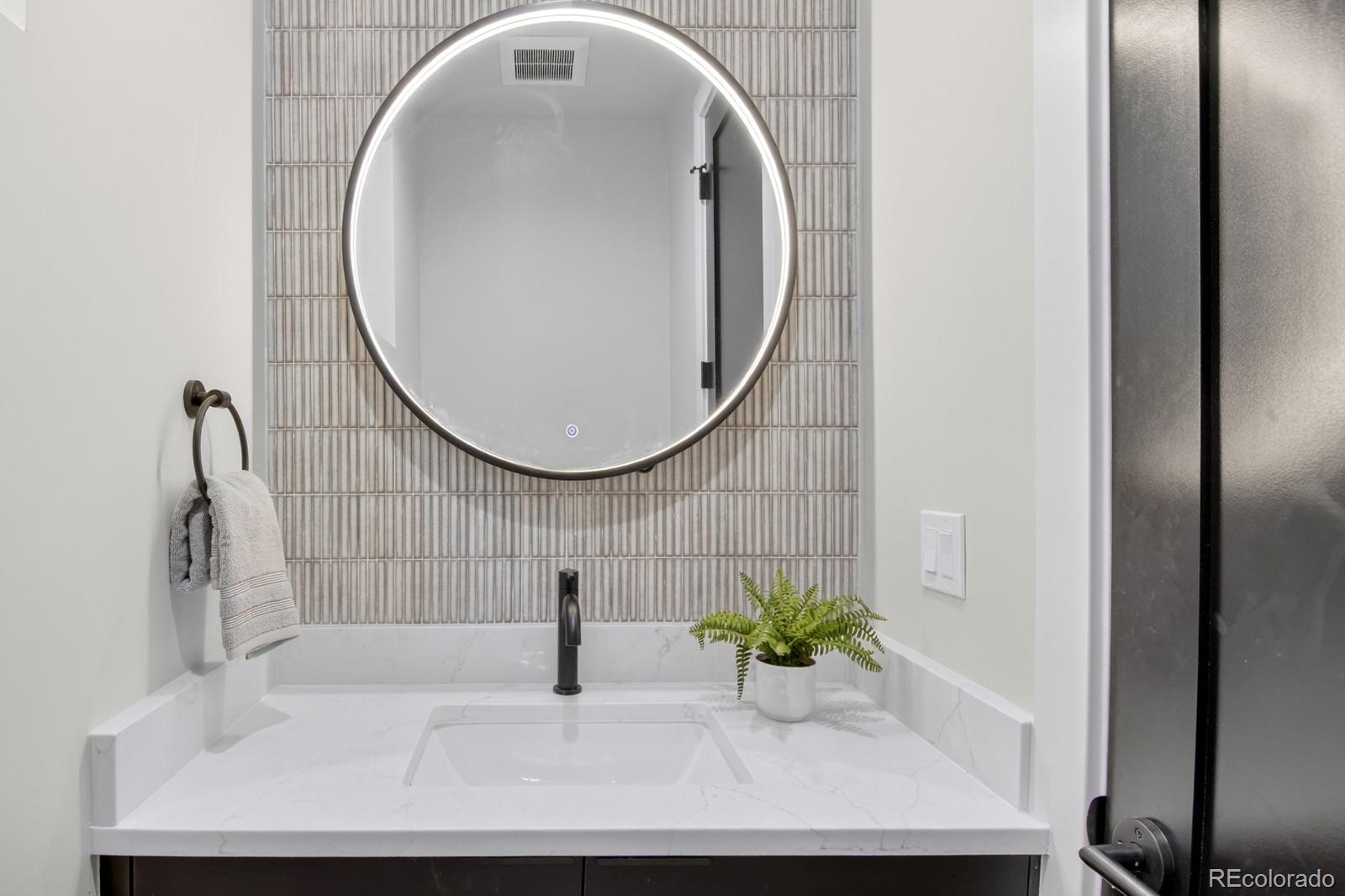 832 North Cherry Street, Unit 1 Denver, CO 80220 - Photo 14 of 41 a bathroom with a sink and a mirror