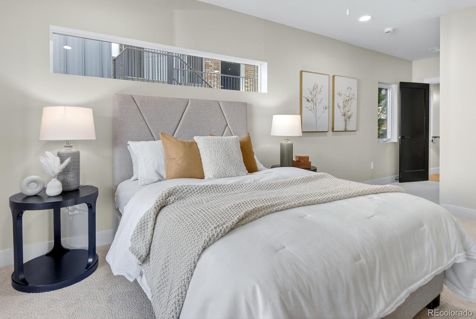 832 North Cherry Street, Unit 1 Denver, CO 80220 - Photo 18 of 41 a bedroom with a bed and a lamp