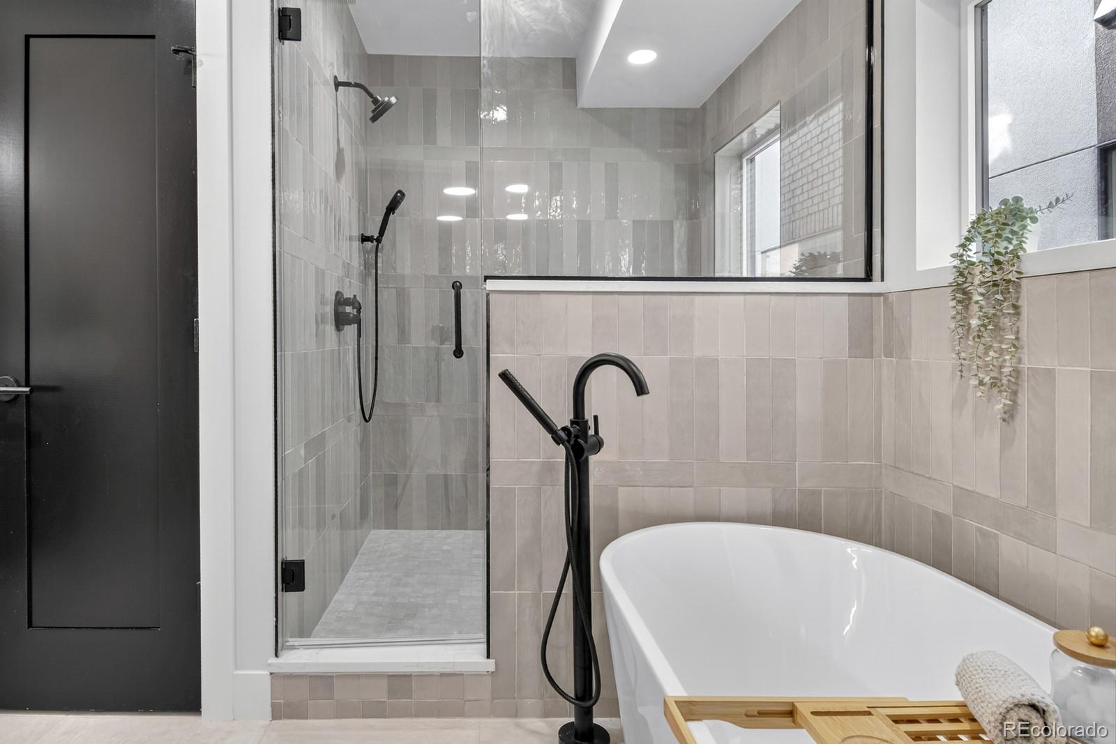 832 North Cherry Street, Unit 1 Denver, CO 80220 - Photo 21 of 41 a bathroom with a bathtub and a shower