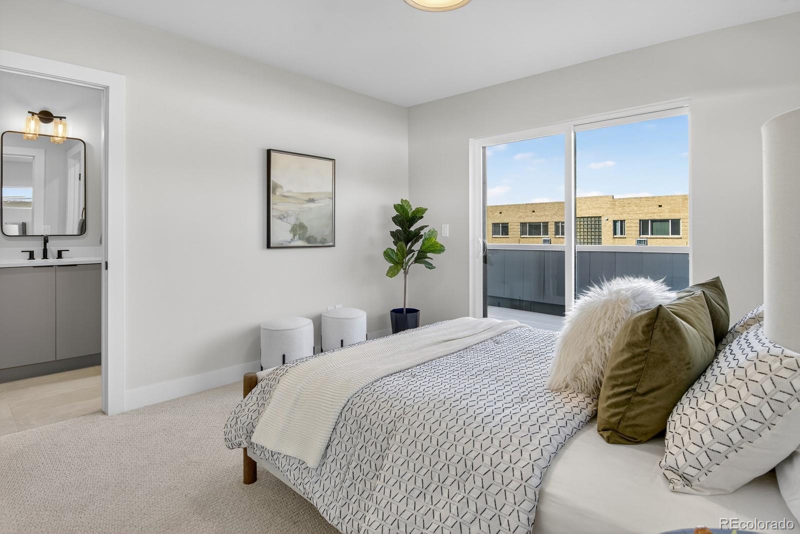 832 North Cherry Street, Unit 1 Denver, CO 80220 - Photo 26 of 41 a bedroom with a bed and a cabinets