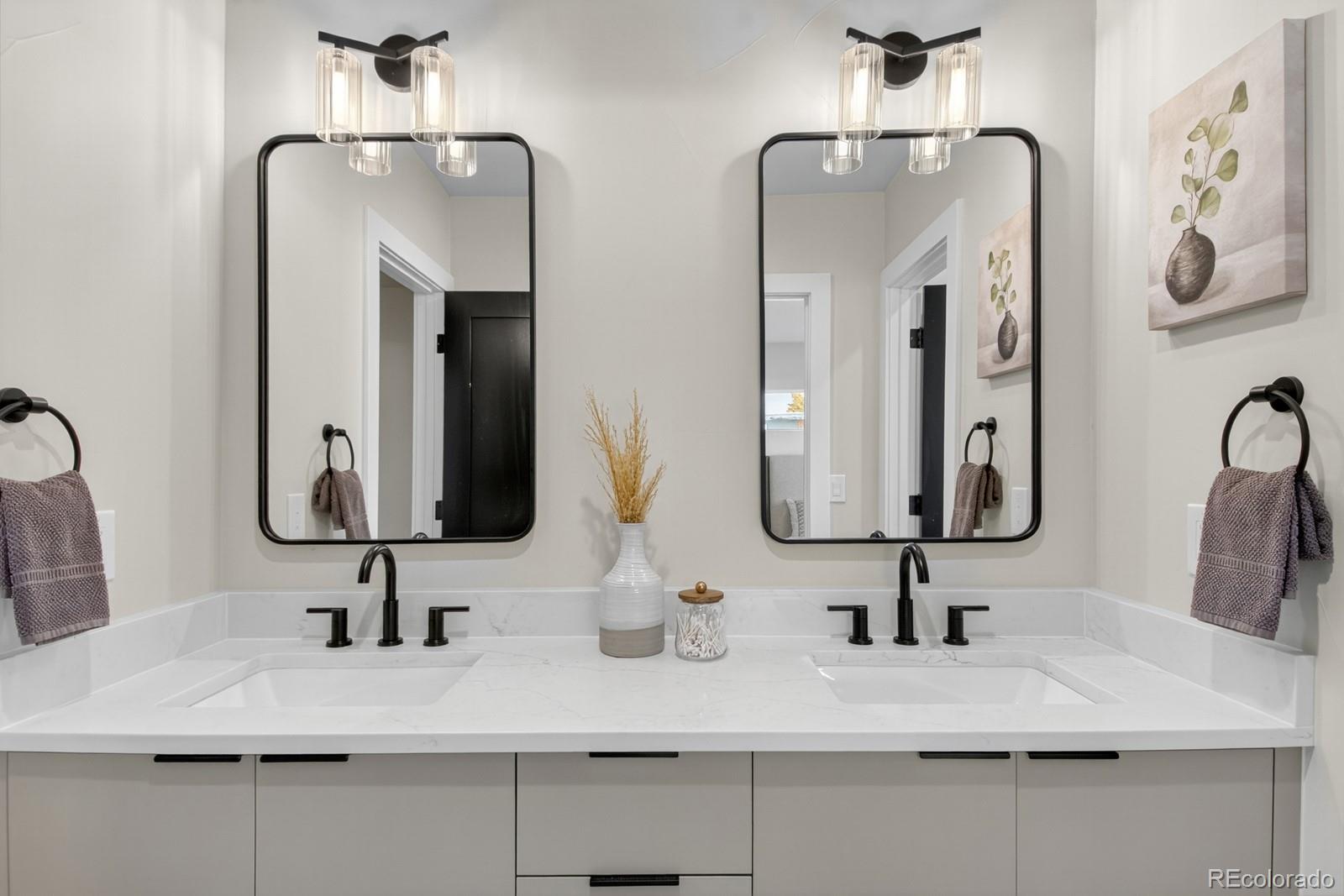 832 North Cherry Street, Unit 1 Denver, CO 80220 - Photo 27 of 41 a bathroom with double vanity sinks and a mirror