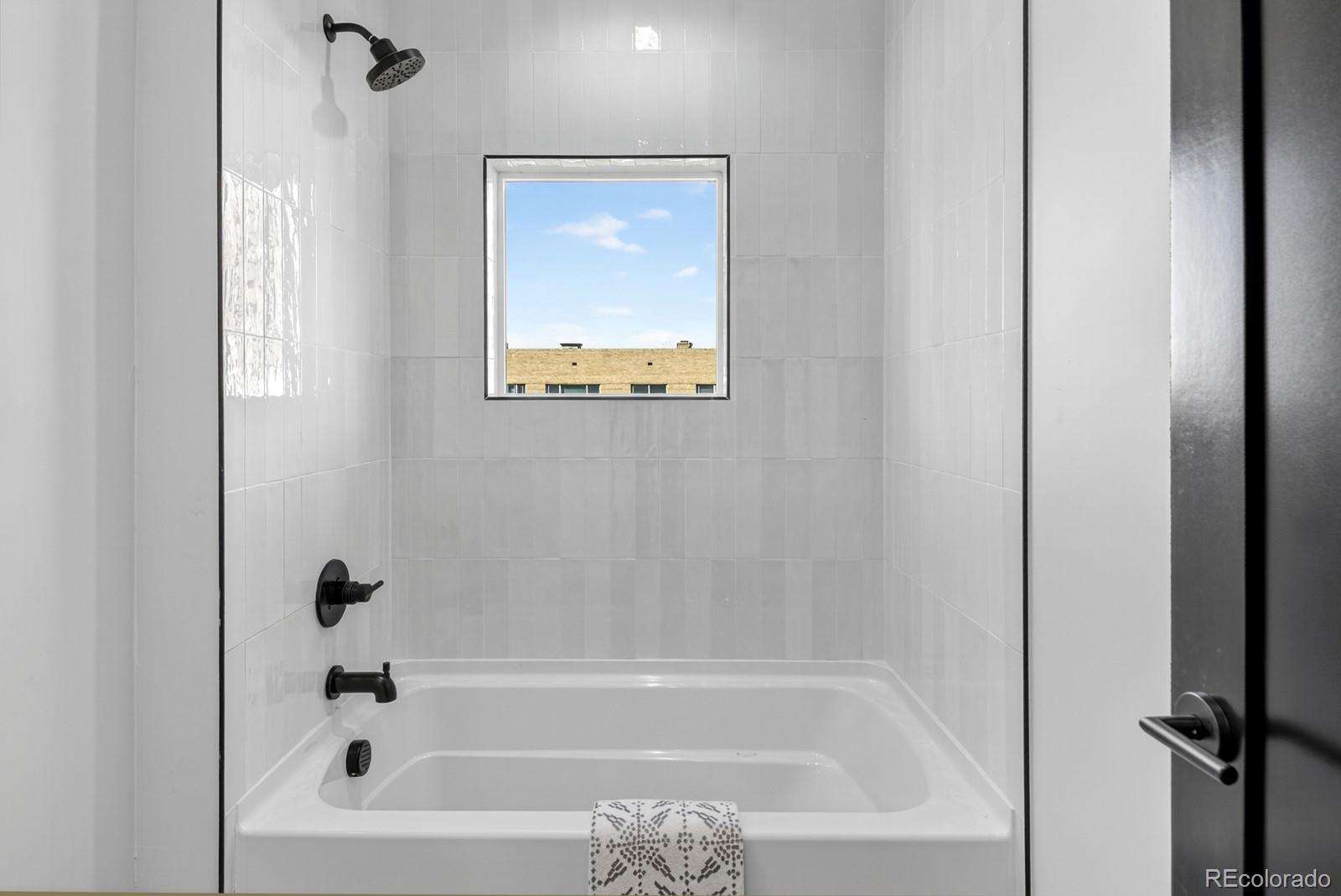 832 North Cherry Street, Unit 1 Denver, CO 80220 - Photo 29 of 41 a bathroom with bathtub and shower