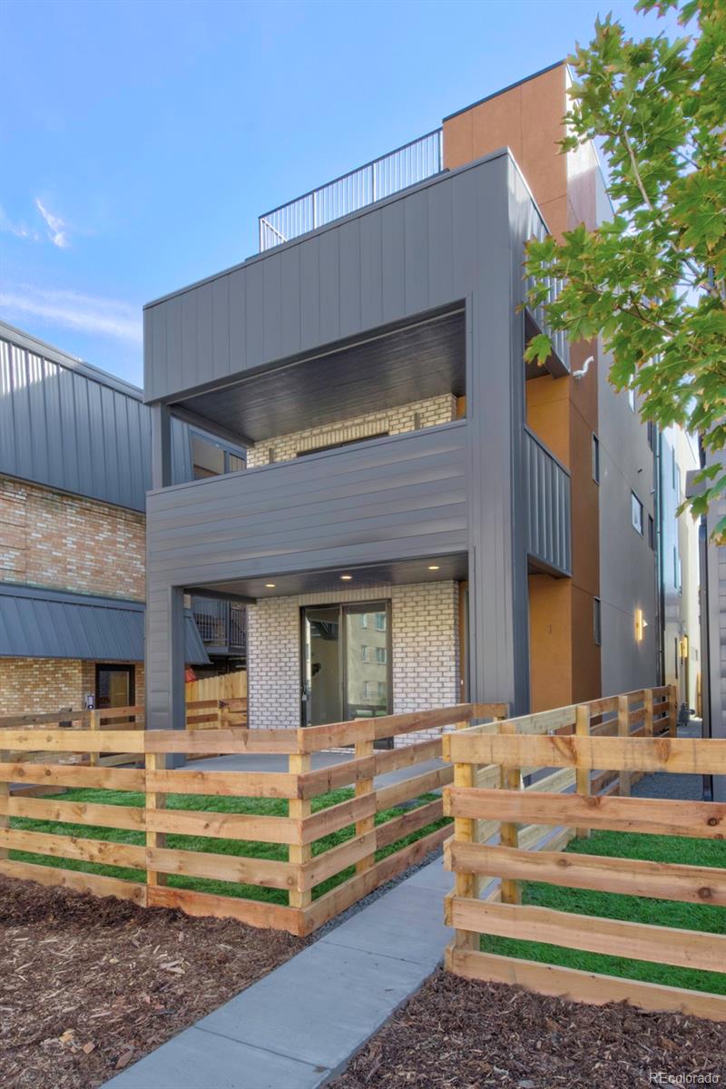 832 North Cherry Street, Unit 1 Denver, CO 80220 - Photo 3 of 41 a front view of a house with a garage