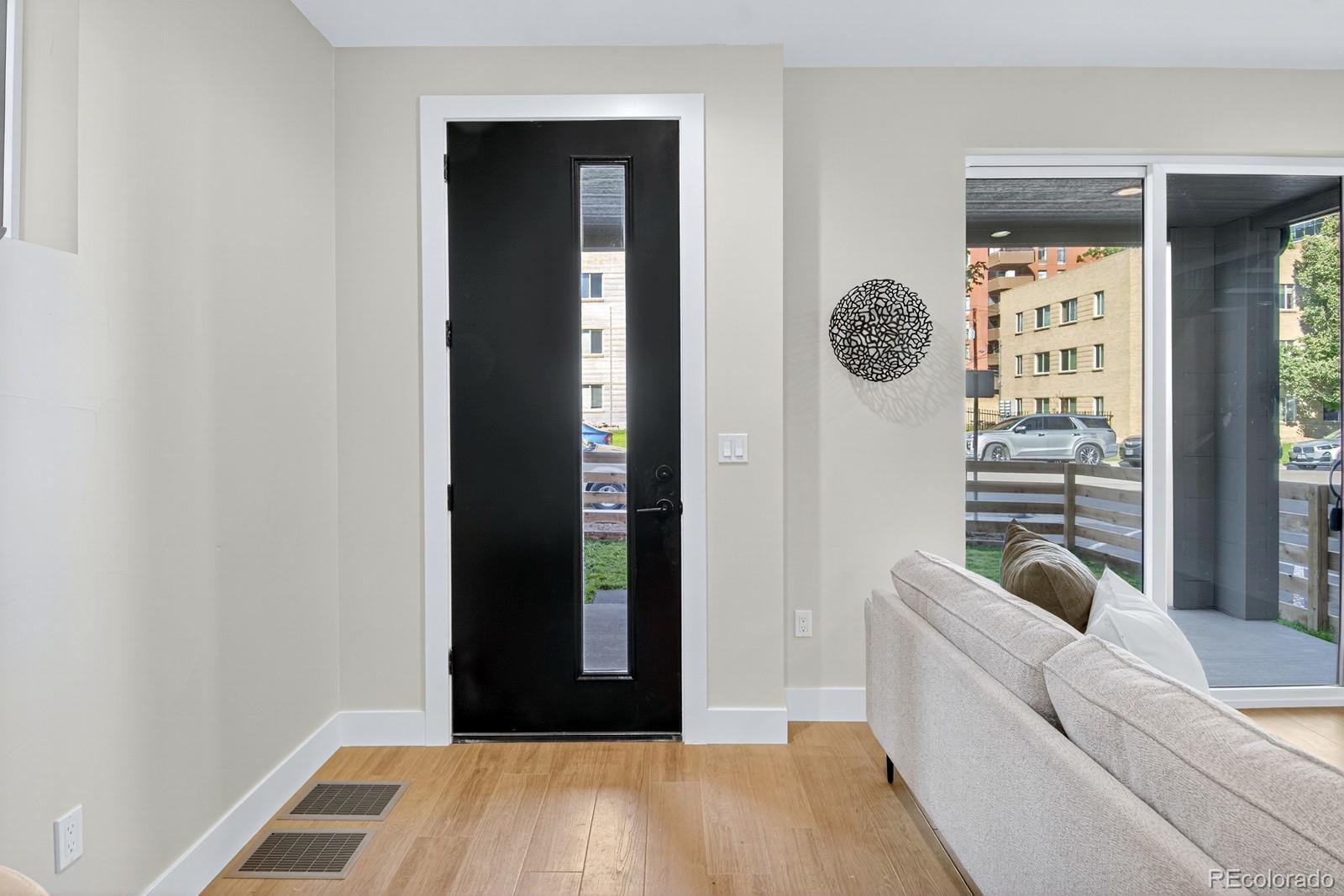 832 North Cherry Street, Unit 1 Denver, CO 80220 - Photo 6 of 41 a living room with furniture and a window