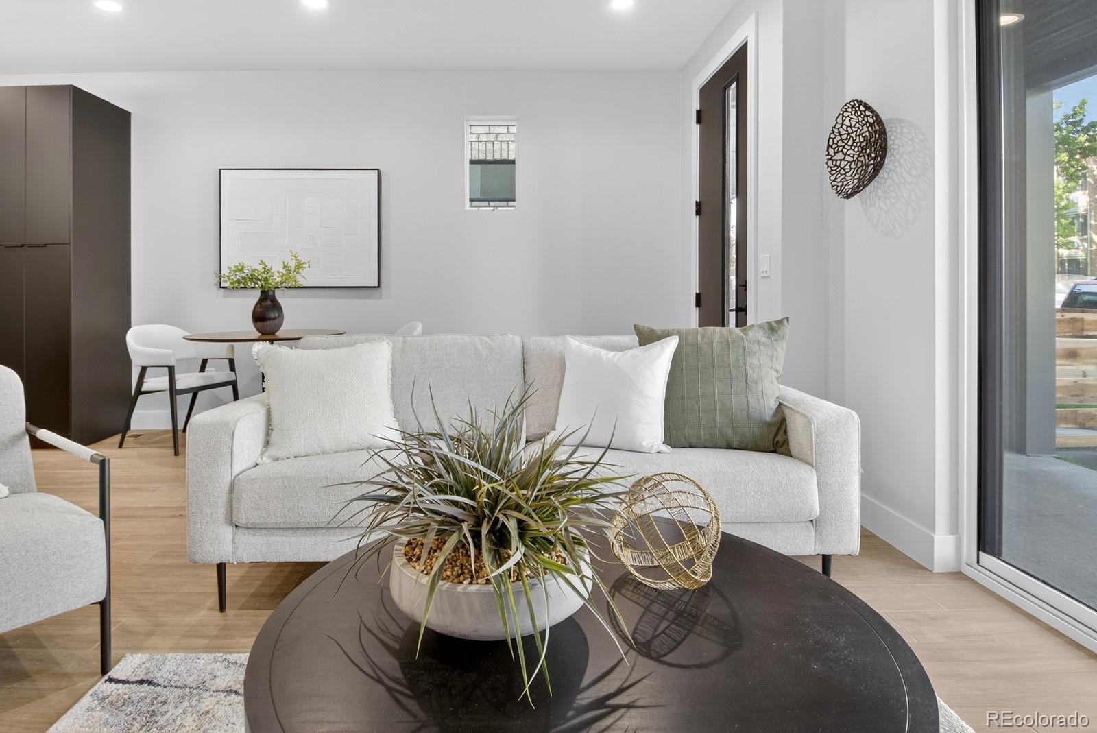 832 North Cherry Street, Unit 1 Denver, CO 80220 - Photo 7 of 41 a living room with furniture and a large window