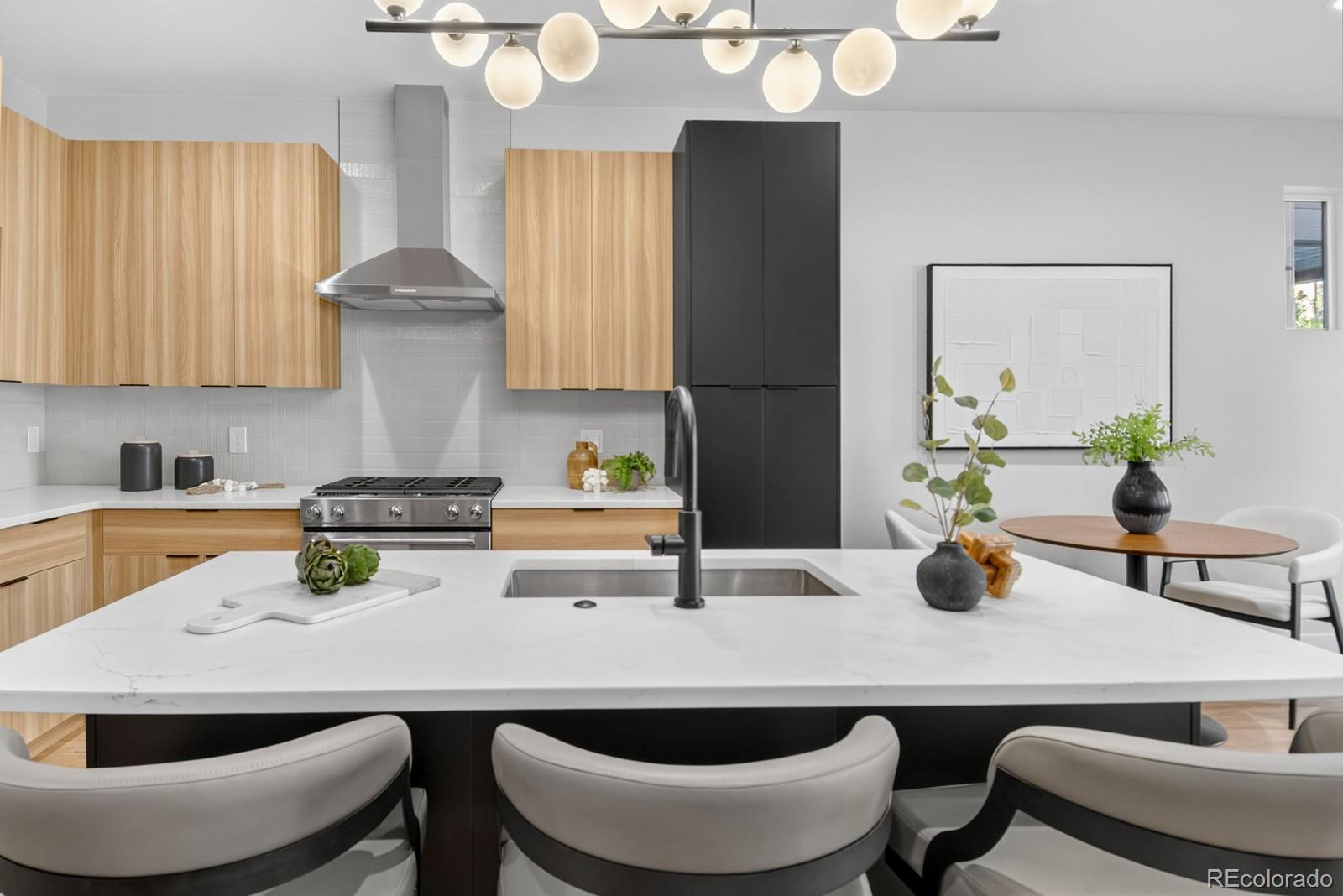 832 North Cherry Street, Unit 1 Denver, CO 80220 - Photo 10 of 41 a kitchen with a table and chairs in it