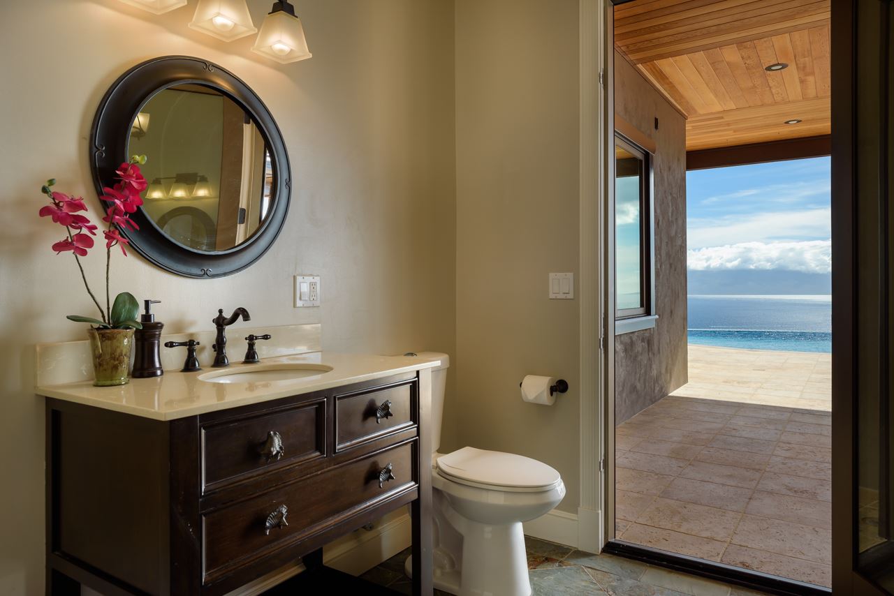 554 Punakea Loop Lahaina, HI 96761 - Photo 14 of 30 a bathroom with a toilet a sink and a mirror