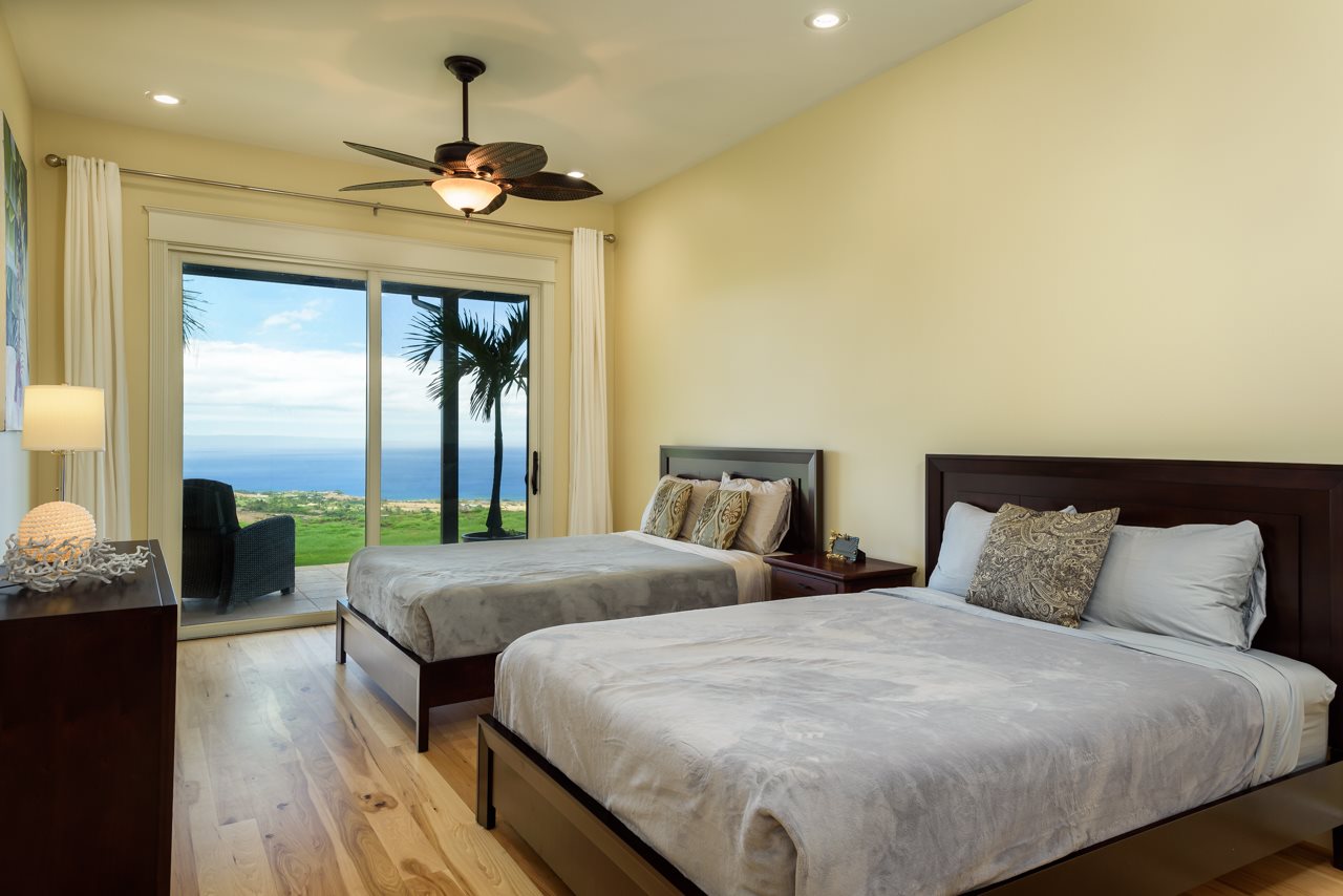 554 Punakea Loop Lahaina, HI 96761 - Photo 17 of 30 a bedroom with double bed and a chandelier